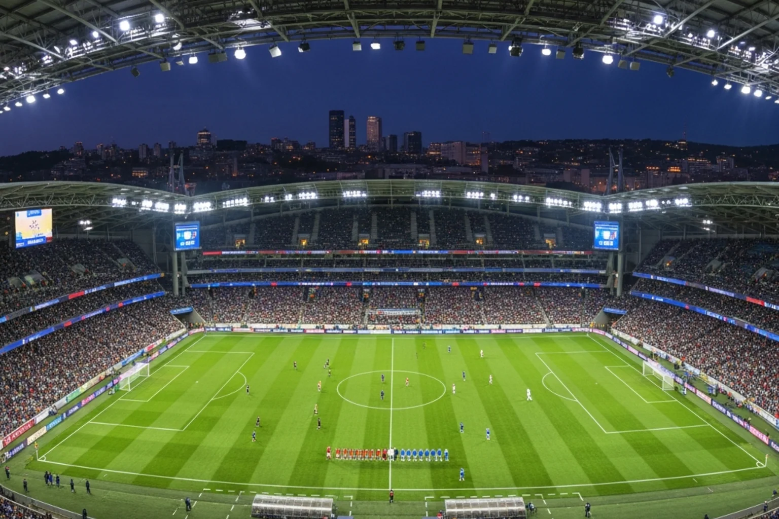 Vue panoramique d'un stade de football rempli de spectateurs lors d'un match international en soirée